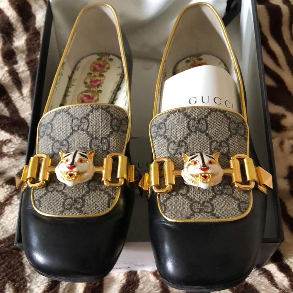 Gucci loafers , one of the kind , black with gold , excellent condition, size 38